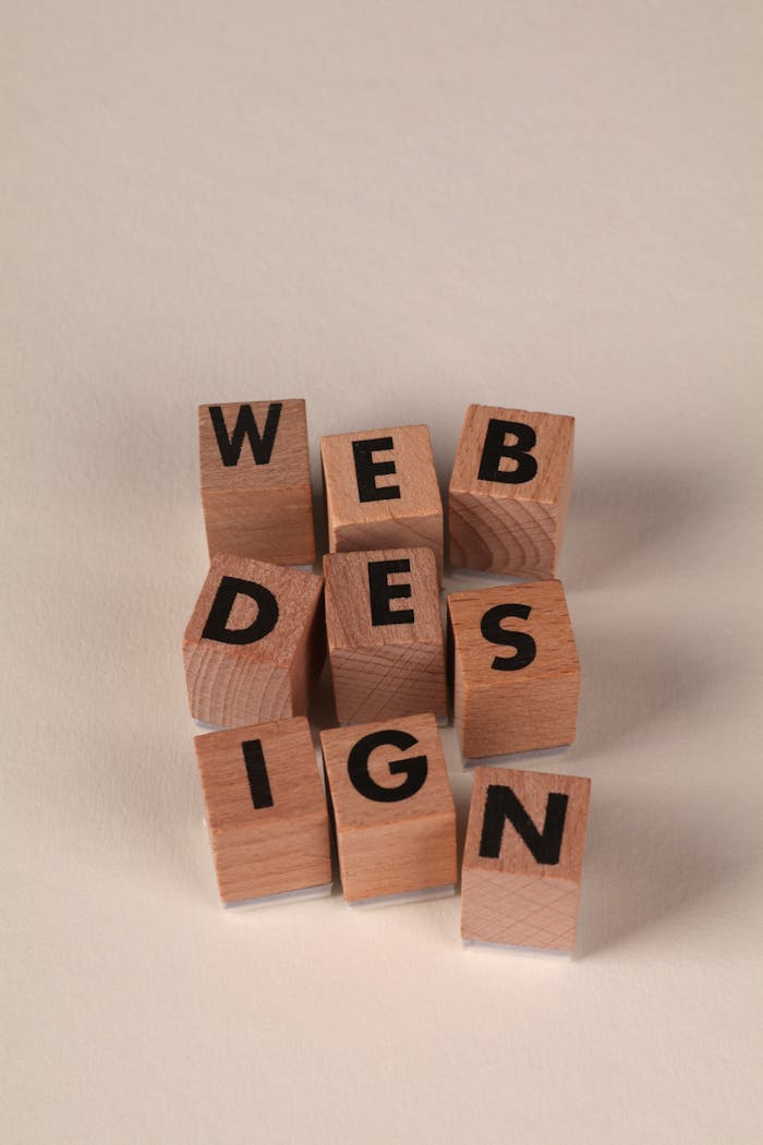 services-02 Wooden blocks arranged to spell 'Web Design'. Perfect for creative, digital content themes.